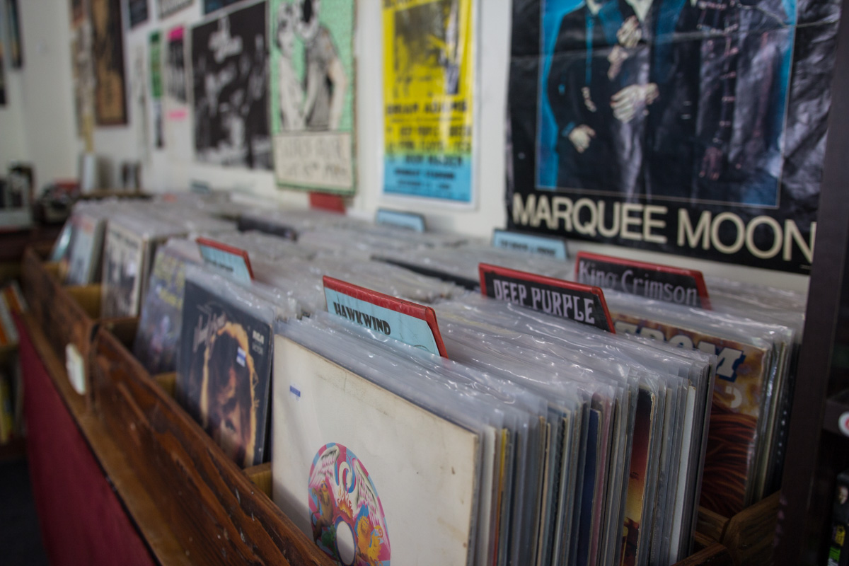 Rows of vinyl records in wooden crates