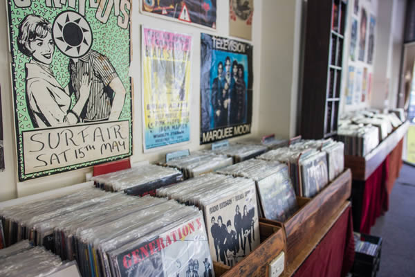Vinyl crates and gig posters inside the shop